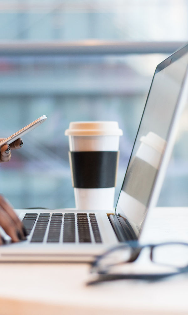 Working on a laptop in a cafe