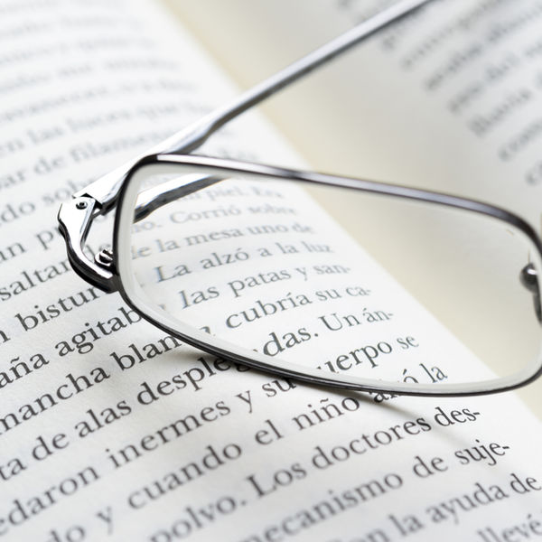 Glasses resting on notes